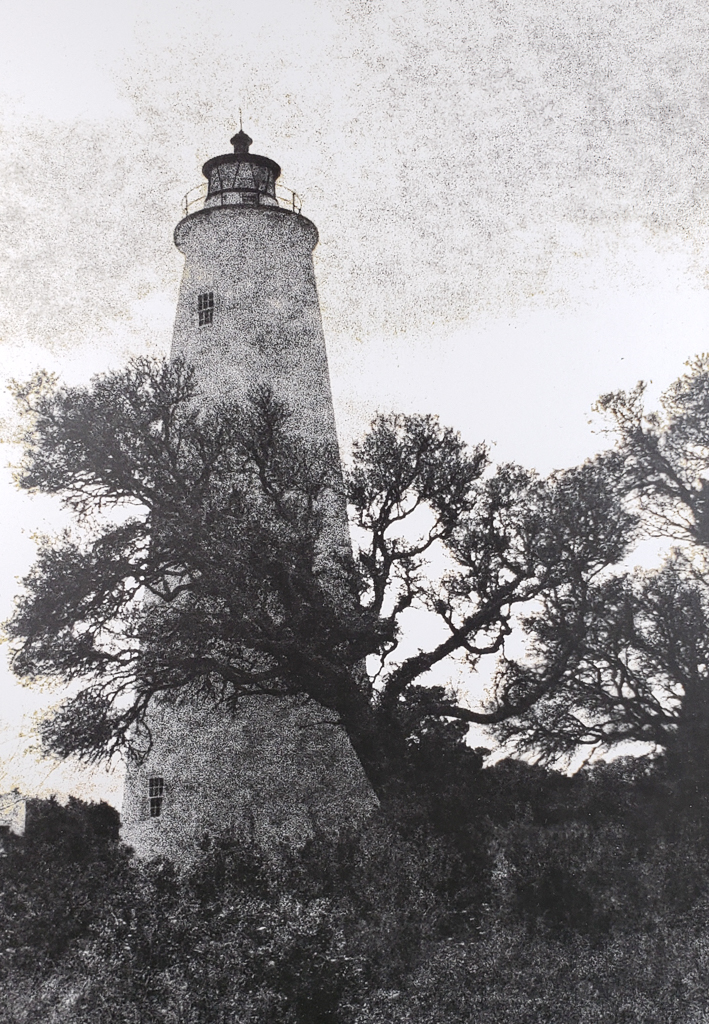 The Ocracoke Island Lighthouse has been a landmark of the NC Outer Banks since 1823. View of the Light through neighboring oak trees. B&W handcrafted alternative process photograph (original silver emulsion print from paper negative). © WJ Eastman Offered by GALLERY5X7