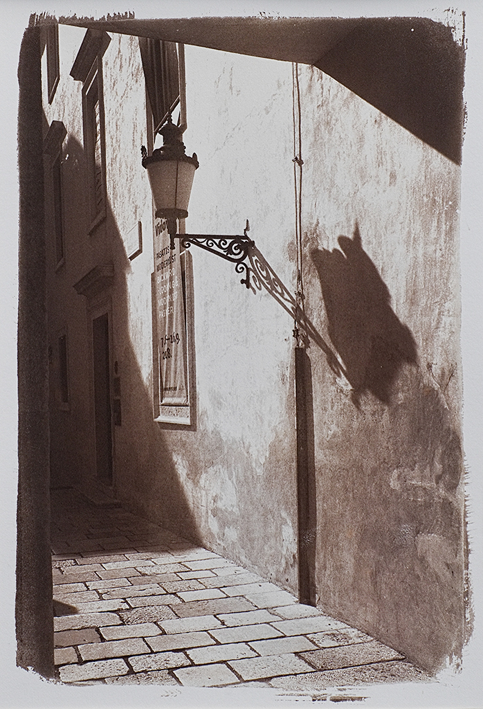 "Croatia Side Street" © Alan Glover. Approx 11x7.5” handcrafted Van Dyke Brown print from a single negative printed on Hahnemuhle Platinum Rag paper. GALLERY5X7 offers this original print, signed on the mount (mount size 16x12”), at $250.