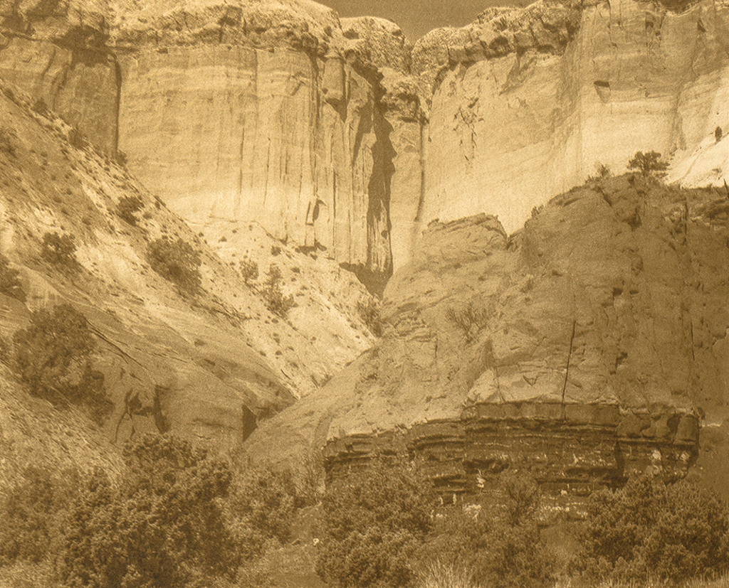 “Rio Arriba County Near Ghost Ranch New Mexico" © Tom Wise. Escarpment in Rio Arriba County near Ghost Ranch New Mexico on road to Christ in the Desert Monastery. Approx. 6x7.5" (15.2x19.1cm) handcrafted alternative process photograph (gum bichromate over palladium-toned kallitype). GALLERY5X7 offers this signed, editioned original print at $250.