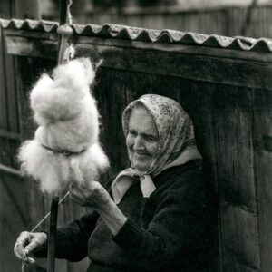 "Spinning Sheep Wool By Hand Wheel, Romania" © Mohan Bhasker. While driving through the remote countryside of Romania, I encountered this moment, an elderly woman with a big smile spinning her wheel as she truly enjoyed her craft and was happy that I was photographing her. Approx. 6x9" (15x23cm) or 12x18" (31x46cm) handcrafted alternative process photograph (platinum/palladium) on Revere Platinum. Signed, original editioned (1/10) print offered by GALLERY5X7.